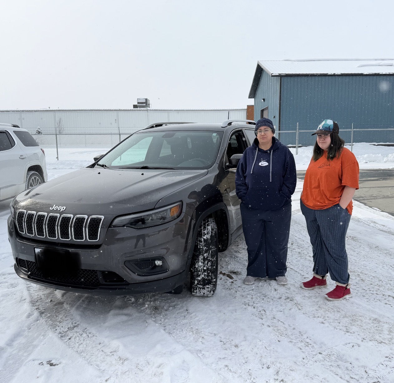 Customers with Jeep Cherokee in snow — Easy Ride Canada, Fort St. John BC